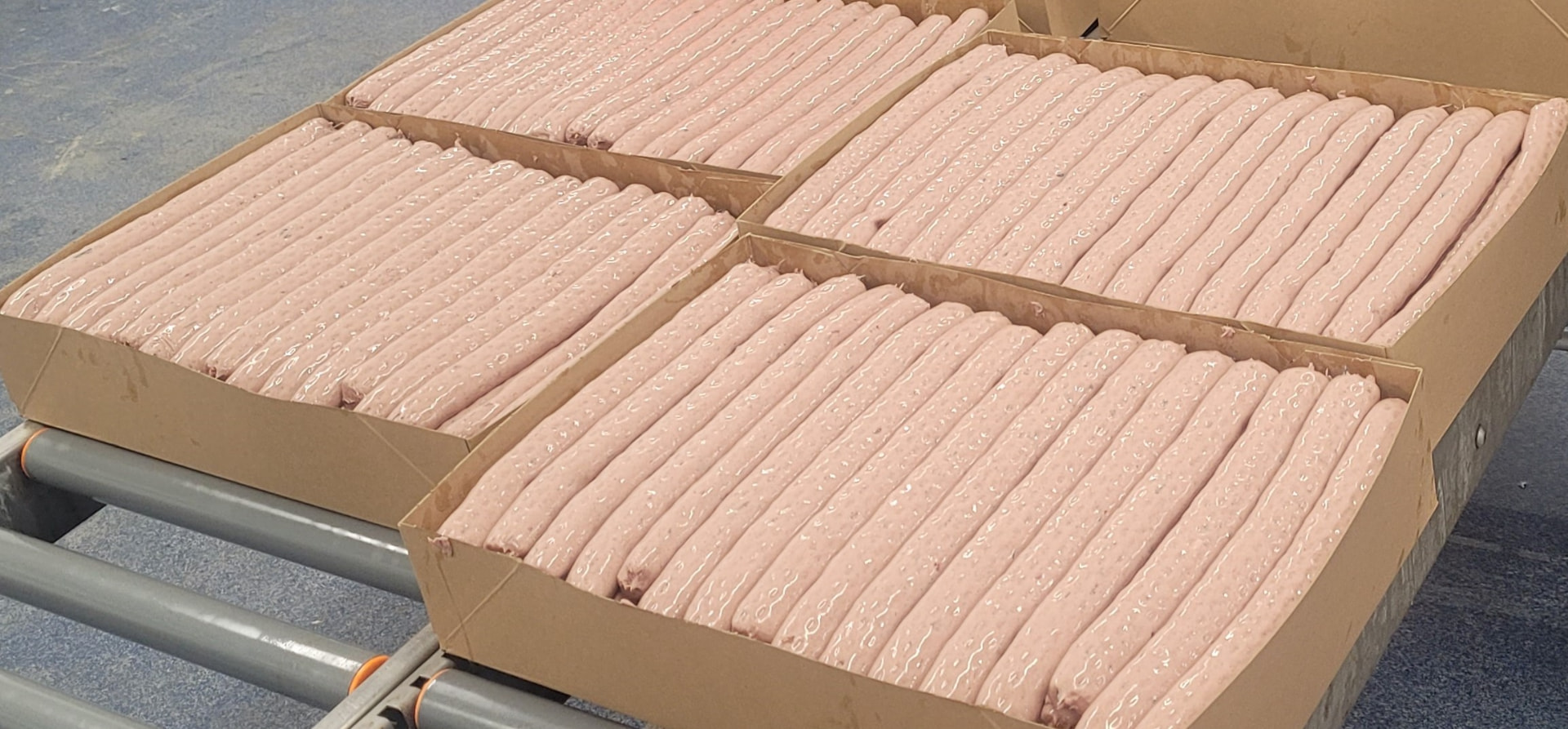 Norbait bait sausages packed in trays at the production facility